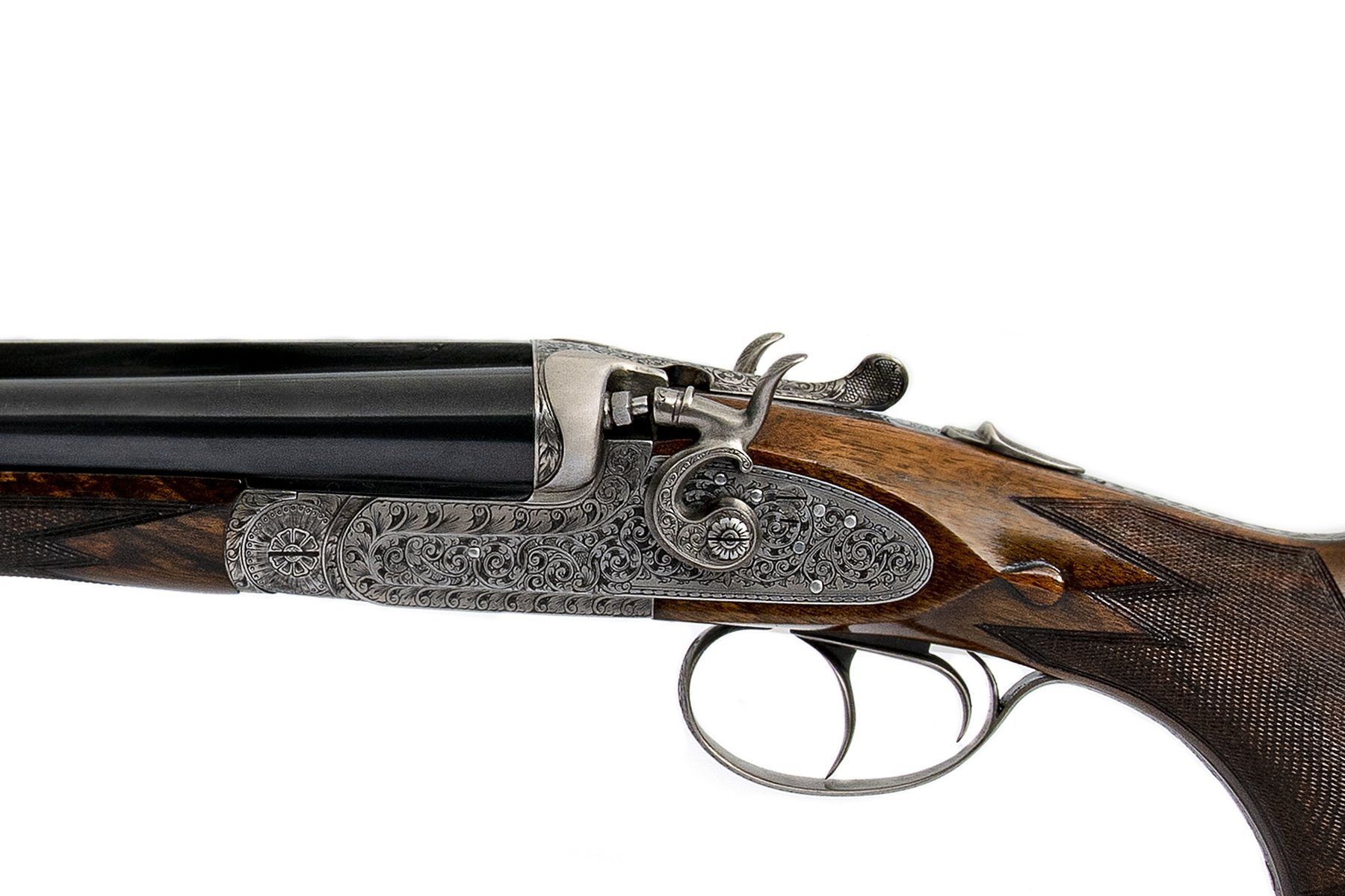 Model C: hammer sidelock, engraved by hand.